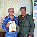Jamie holds the flight certificate he received after he flew the MiG-29 in Russia with Sokol test pilot Andrey Pechionkin.