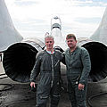 Jamie stands with Sokol Test Pilot Andrey Pechionkin behind the incredible MiG-29.