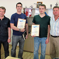 After their MiG flights, the two adventurers were presented with framed flight certificates. From left to right: Sokol Test Pilot Yuri Polyakov, Jeff from the US, Petru from Switzerland, Sokol Test Pilot Andrey Pechionkin.