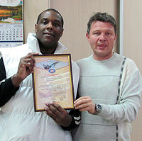 Robert traveled from Baltimore to Nizhny Novgorod to fly to the edge of space with top Sokol Test pilot Sergey Kara. Here Robert receives a signed and framed flight certificate from the airbase.
