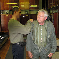 Ray was carefully fitted for a pressure suit, flight suit, helmet, oxygen mask and boots.