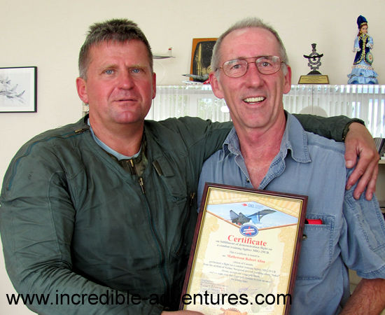 Russian fighter pilot Andrey Pechionkin presents Bob with Flight Certificate