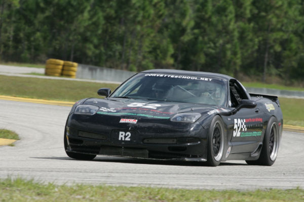 Racing Corvette at high speed at high performance driving school