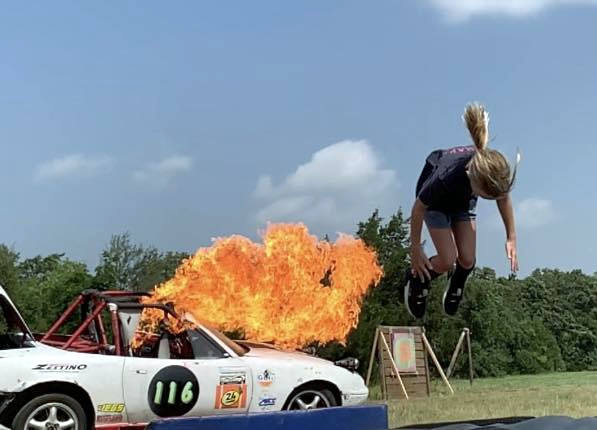 Stunt artist leaps from burning car